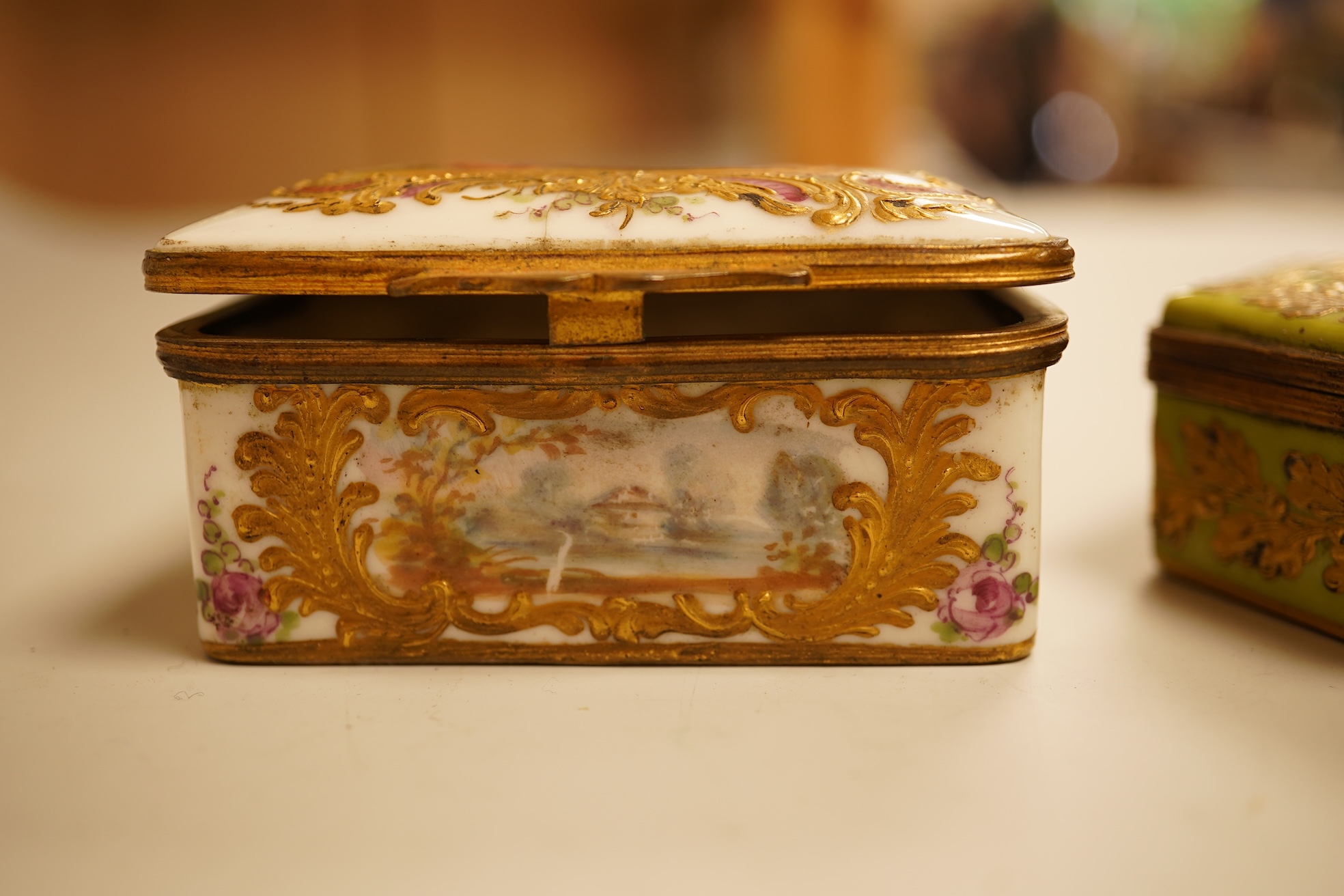 A Zsolnay lustre 'chicken' box and cover and two Sevres style porcelain boxes and covers (3) ‘chicken box’ 5cm diameter.